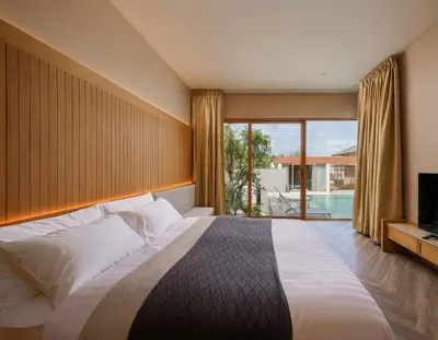 a bedroom with a large bed and a large window at Celestia Villas - Pool villa 4BR near Boat Avenue in Ban Pak Lak
