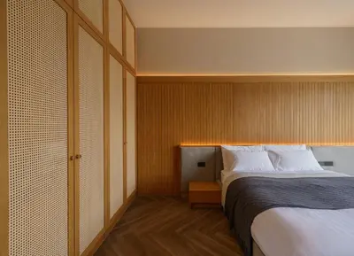 a hotel room with a bed and a closet at Celestia Villas - Pool villa 4BR near Boat Avenue in Ban Pak Lak