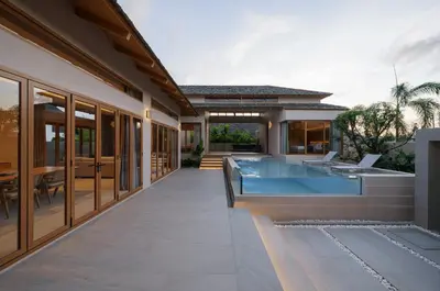 an external view of a house with a swimming pool at Celestia Villas - Pool villa 4BR near Boat Avenue in Ban Pak Lak