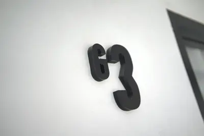 a number on the side of a building at wolin patong greeen resort in Patong Beach