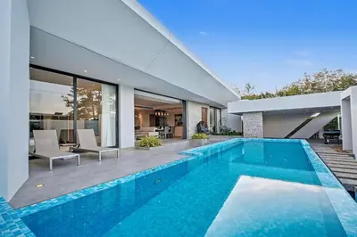 a swimming pool in the backyard of a house at C32 Clover Residence Villa Phuket 3 bd in Ban Thalat Choeng Thale