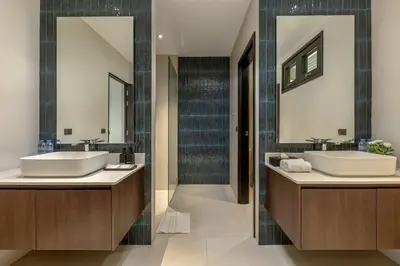 a bathroom with two sinks and two mirrors at 6-Bedroom Private Luxury Pool Villa in Layan in Thalang