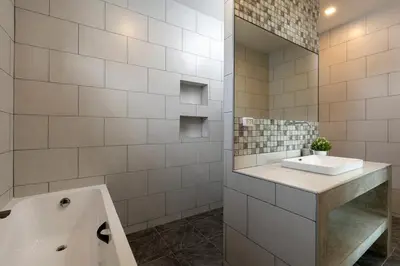 a white bathroom with a sink and a mirror at Modern and Peaceful 3Bedroom Villa Family Retreat Rawai in Ban Saiyuan (1)