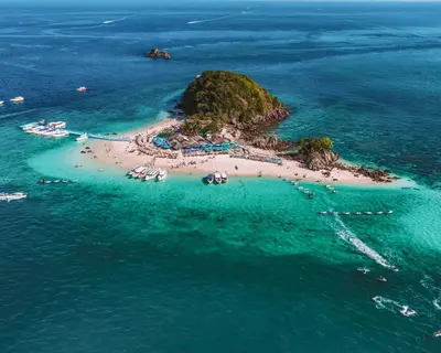 an island in the ocean with people on a beach at BB Luxury Villa in Phuket Town