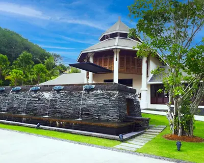 a building with a fountain in front of it at BB Luxury Villa in Phuket Town