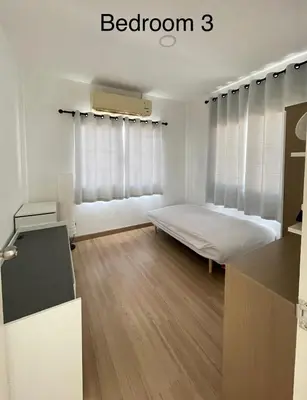 a white room with a bed and a window at Spacious Modern Home & Garden Perfect for Families in Ban Na Nai