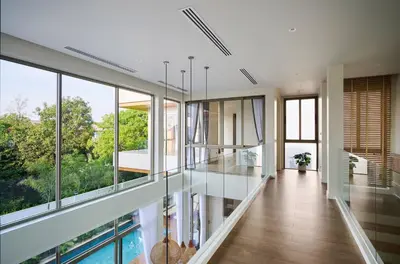 a house with a pool and glass walls at New Cozy 3BR Pool Villa Best Location- Boat Avenue in Ban Thalat Choeng Thale