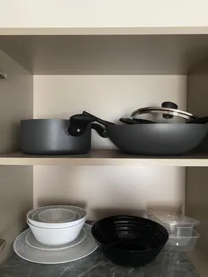 a shelf with a pan and bowls on it at D Condo Reef Kathu,Near Patong beach in Kathu