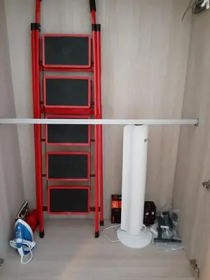 a room with a red ladder and a desk at D Condo Reef Kathu,Near Patong beach in Kathu