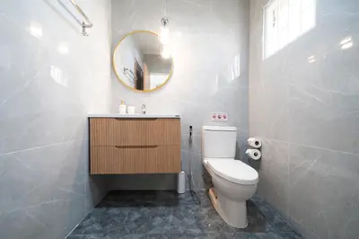 a bathroom with a toilet and a sink and a mirror at Heart Patong pool villa with 5bedrooms in Patong Beach