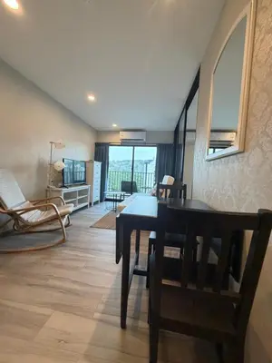 a dining room with a table and chairs in a room at 1 BDR 5 Swimming Pool Entire Apt Complex 5 Mins WALK To Naiyang Beach in Phuket