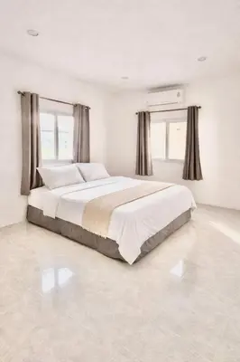 a white bedroom with a large bed with windows at Phuket Villa - Private Pool in Ban Kathu