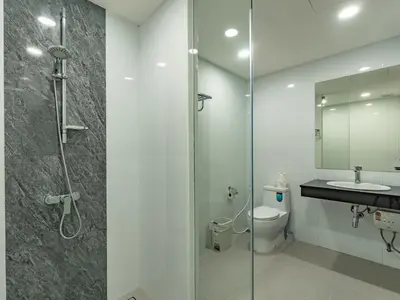 a bathroom with a shower and a toilet and a sink at Brand New Private pool villa Chalong Phuket Mountain view in Ban Klang