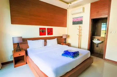 a bedroom with a large white bed and a sink at 2 bedroom pool villa 250m TO Rawai beach A5 in Rawai Beach