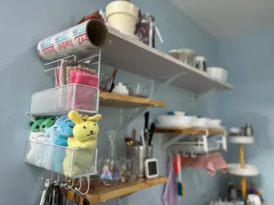 a shelf with a stuffed animal on it in a kitchen at Spacious Garden Loft Home Studio Workation & Fit in Ban Na Nai