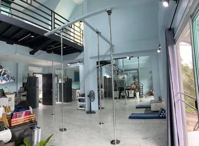 a room with a gym with a large glass wall at Spacious Garden Loft Home Studio Workation & Fit in Ban Na Nai