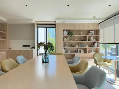 a kitchen with a large wooden table and chairs at Gloria's Laguna Nest in Ban Thalat Choeng Thale
