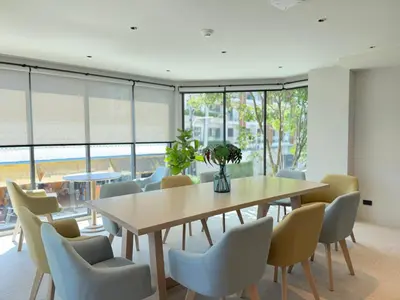 a dining room with a table and chairs at Gloria's Laguna Nest in Ban Thalat Choeng Thale