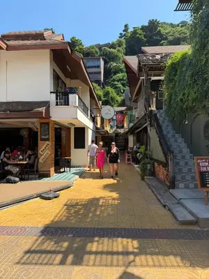 a group of people walking down a street at Aura Hotel Phi Phi in Phi Phi Don