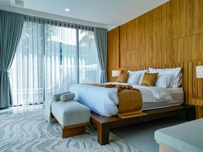 a bedroom with a large bed and a large window at Andara Ao Nang Pool Villa in Ao Nang Beach