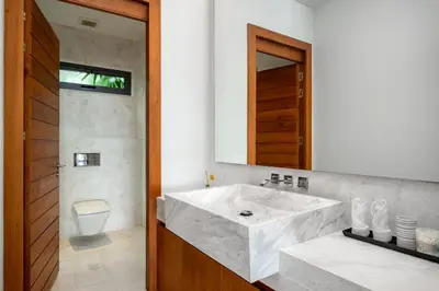 a bathroom with a large white sink and a mirror at Absolute Beachfront Villa 3-Bedroom in Rawai in Ban Saiyuan (1)