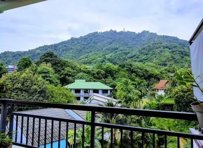 a balcony with a view of a mountain at Pathaya in Ban Kata