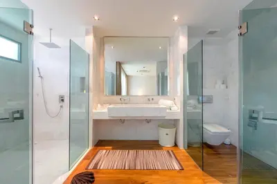 a bathroom with a sink and a mirror at 4-Bed Villa-Sweeping Sunrise View over Chalong Bay in Ban Saiyuan (1)