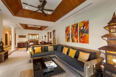 a living room with a couch and a table at Villa Barron - Spacious Luxury Family Holiday Home in Chalong