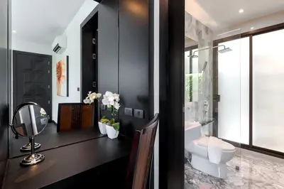a bathroom with a white toilet and a mirror at 2-Bed Pool Villa Chalong-Bright Modern & Relaxing in Ban Suan