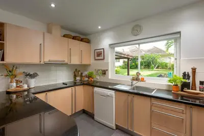a kitchen with a sink and a window at Peaceful 2-Bedroom Villa on Loch Palm Golf Course in Ban Kathu