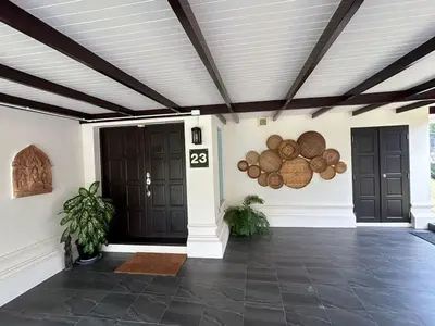 a room with two black doors and a ceiling at Peaceful 2-Bedroom Villa on Loch Palm Golf Course in Ban Kathu