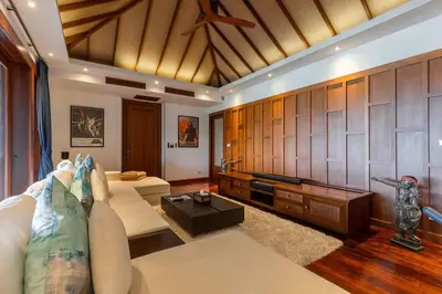 a living room with a couch and a table at Villa Elan Luxury Surin Villa Panoramic Sea Views in Surin Beach
