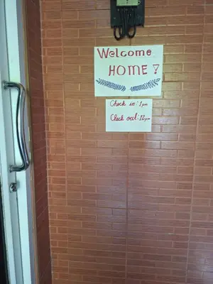 a door with a welcome home sign on it at Budget Place Homestay-Solo Traveler in Ban Dan