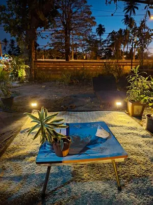 a table with a potted plant on top of it at Budget Place Homestay-Solo Traveler in Ban Dan