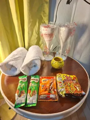 a table with some snacks on a table with towels at Budget Place Homestay-Solo Traveler in Ban Dan