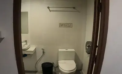 a bathroom with a toilet and a sink at Phi Phi Green House & Sunsky Hostel in Phi Phi Don
