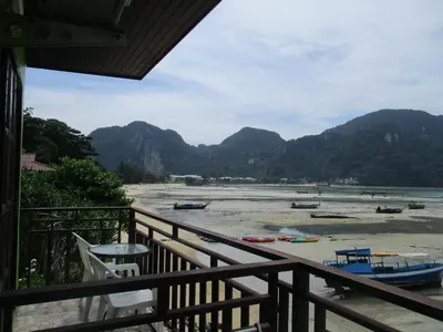 a view from a balcony of a river with boats on it at Phi Phi Green House & Sunsky Hostel in Phi Phi Don