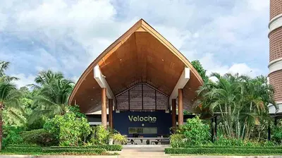 a view of a building with a bench in front at Veloche Karon by Investing In Phuket in Ban Karon