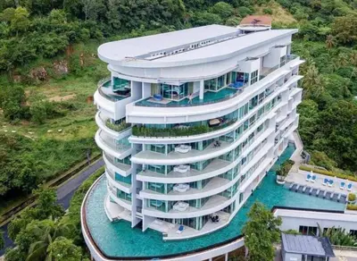 an aerial view of a large building with water at Veloche Karon by Investing In Phuket in Ban Karon