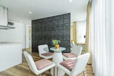 a dining room with a table and chairs at Comfort SeaView Apartment with Private Plunge Pool in Patong Beach