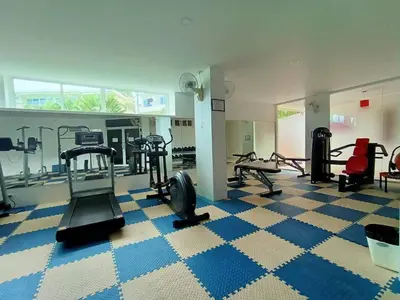 a gym with several treadmills and elliptical machines at The nice condo 2 BR at Karon in Karon Beach