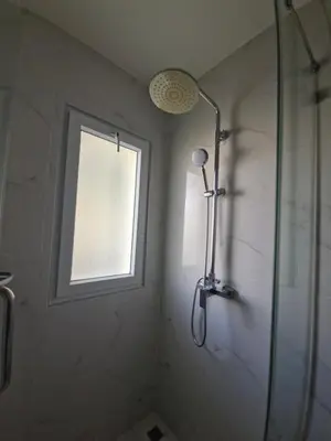 a shower in a bathroom with a window at The nice condo 2 BR at Karon in Karon Beach