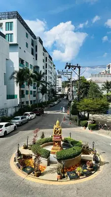a view of a street with cars parked on the road at Oh'tel Kata in Kata Beach