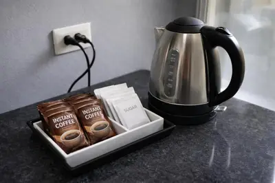 a tray with a coffee maker and a tea kettle at D Condo Kathu Monthly Stay Near Patong 30 Day Minimum in Kathu