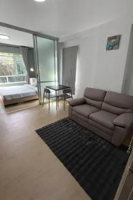 a living room with a couch and a table at D Condo Kathu Monthly Stay Near Patong 30 Day Minimum in Kathu