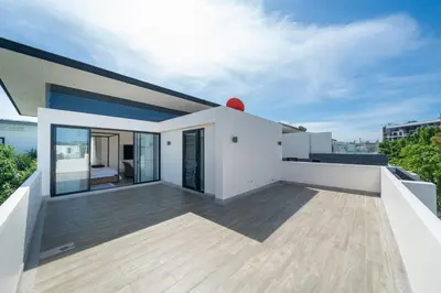 a modern house with a balcony with a bedroom at Luxury 5 bed Laguna Park no Pool in Laguna Phuket