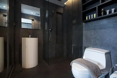a bathroom with a white toilet and a shower at 2 BR Pool View in Wellness Residence near Beach P503-4 in Kamala Beach