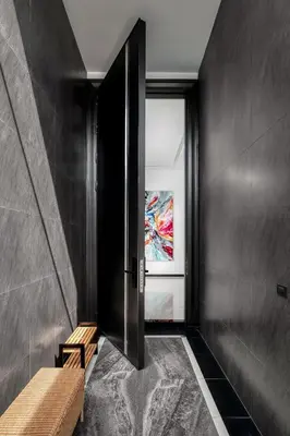a hallway with a door and a bench and a window at Prestige 4BR Private Pool Residence in Rawai in Ban Kata