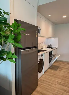 a kitchen with a stainless steel refrigerator and a dishwasher at Family apartment 2-BR with Sea View - Karon Beach in Ban Karon