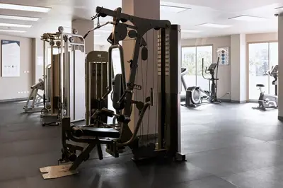 a gym with several treadmills and tread machines at Family apartment 2-BR with Sea View - Karon Beach in Ban Karon